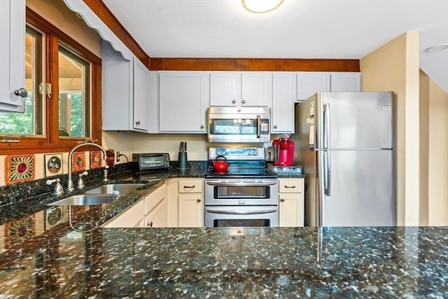 76 Beaver Rd, Ware, MA 01082 - kitchen with stainless steel appliances, dark stone countertops, and white cabinets
