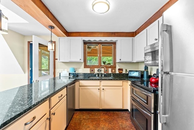 76 Beaver Rd, Ware, MA 01082 - kitchen featuring stainless steel appliances, plenty of natural light, dark stone counters, and decorative light fixtures