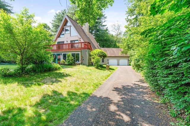 76 Beaver Rd, Ware, MA 01082 - a-frame home with a chimney, a detached garage, and a front yard