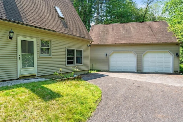 76 Beaver Rd, Ware, MA 01082 - view of front facade featuring driveway, an attached garage, and roof with shingles