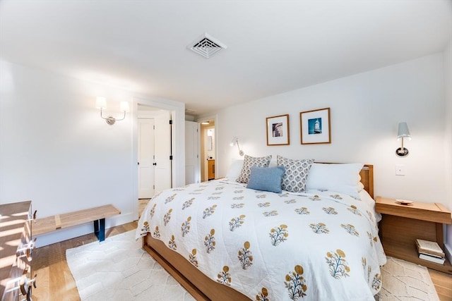 bedroom with light hardwood / wood-style floors