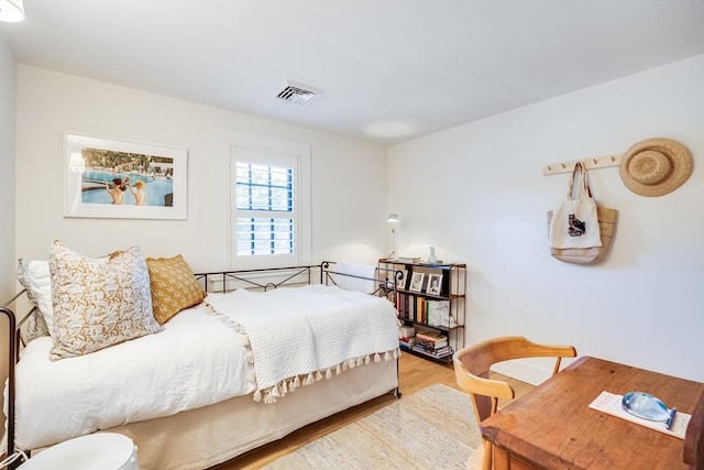 bedroom featuring hardwood / wood-style flooring