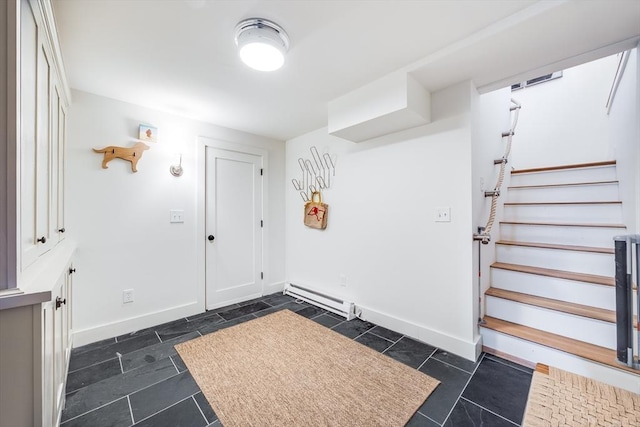 entryway with a baseboard radiator