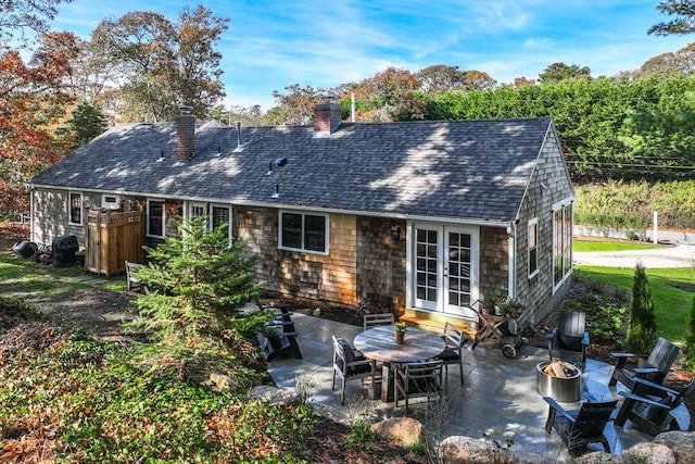 back of property with french doors and a patio