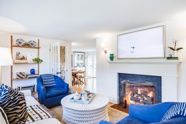 living room featuring french doors and hardwood / wood-style flooring