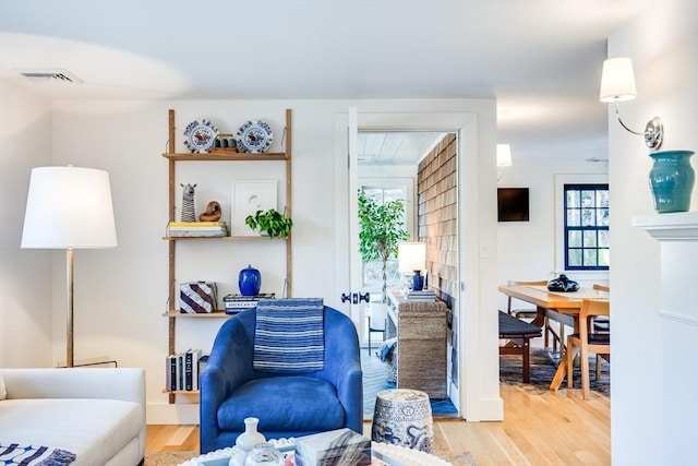 living room featuring plenty of natural light and hardwood / wood-style flooring