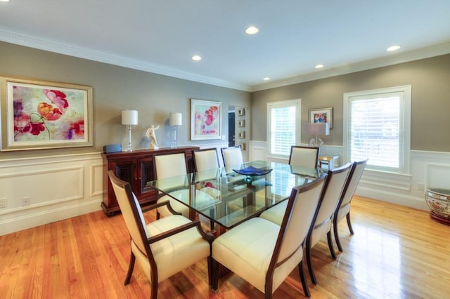 dining space featuring ornamental molding, light wood-type flooring, and recessed lighting