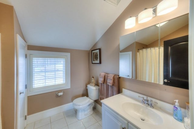 full bath featuring baseboards, toilet, tile patterned flooring, vaulted ceiling, and vanity