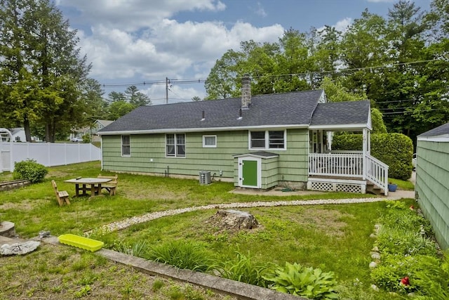299 Shaker Rd, Westfield, MA 01085 - rear view of property featuring roof with shingles, a chimney, and central AC unit