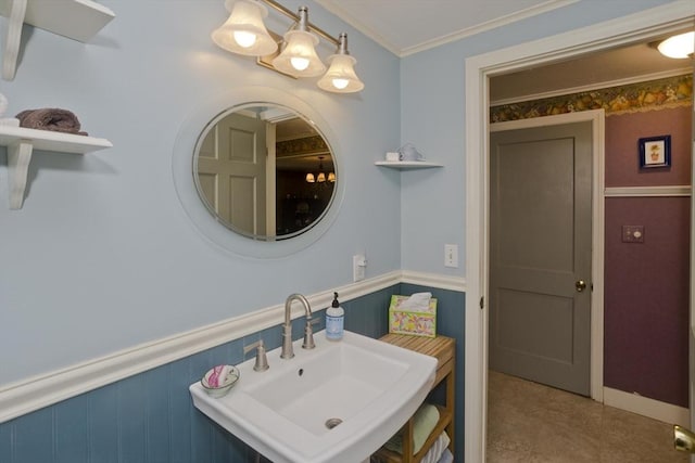 299 Shaker Rd, Westfield, MA 01085 - bathroom with a sink, a wainscoted wall, and crown molding