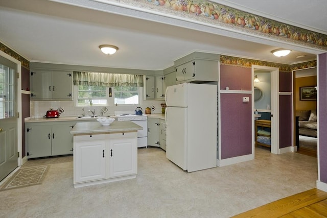 299 Shaker Rd, Westfield, MA 01085 - kitchen featuring freestanding refrigerator, light countertops, a sink, tasteful backsplash, and a center island