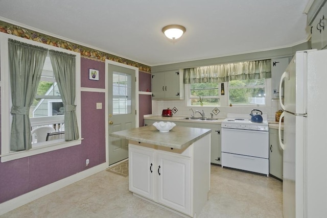 299 Shaker Rd, Westfield, MA 01085 - kitchen with white appliances, plenty of natural light, light countertops, and crown molding