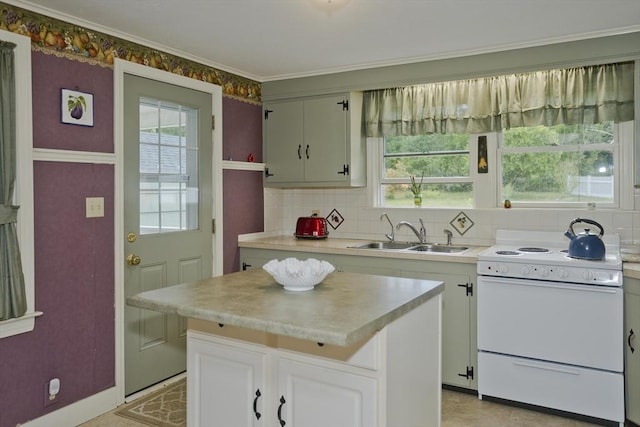 299 Shaker Rd, Westfield, MA 01085 - kitchen with electric stove, a sink, light countertops, crown molding, and a center island