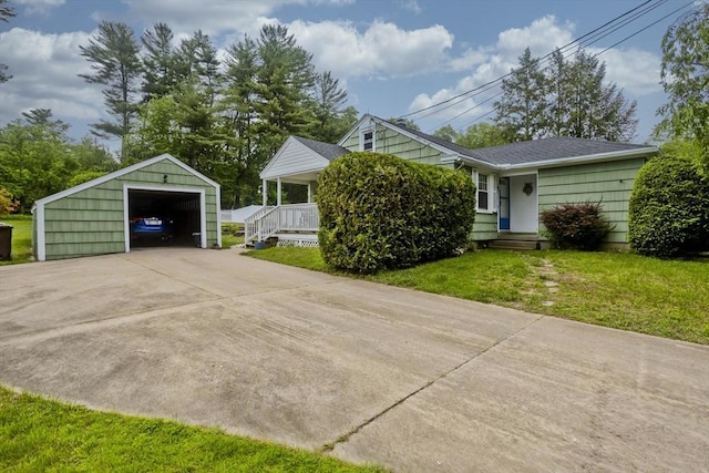 299 Shaker Rd, Westfield, MA 01085 - view of side of home featuring a detached garage, an outbuilding, a yard, concrete driveway, and a porch