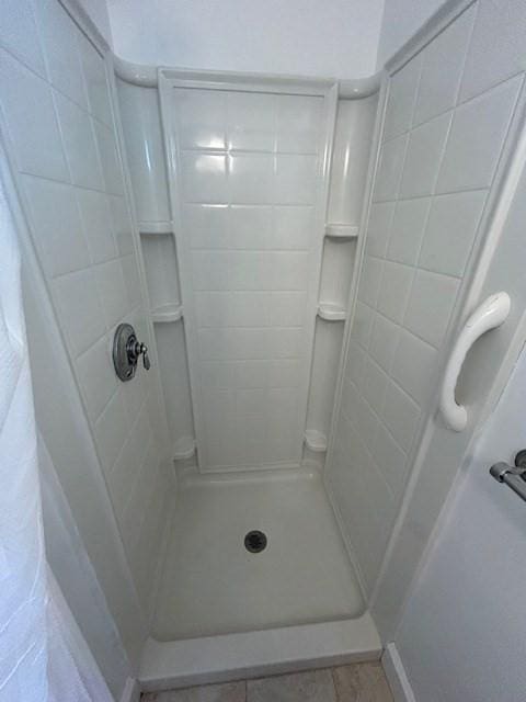 bathroom featuring a stall shower