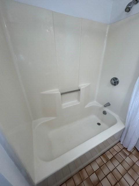 full bath featuring tile patterned flooring