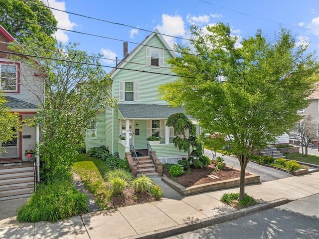 25 Autumn St, Everett, MA 02149 - american foursquare style home featuring covered porch and stairs