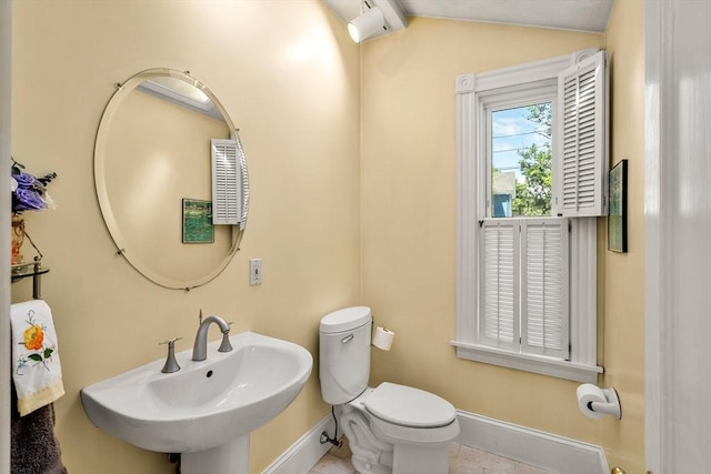 25 Autumn St, Everett, MA 02149 - half bathroom with lofted ceiling and tile patterned flooring