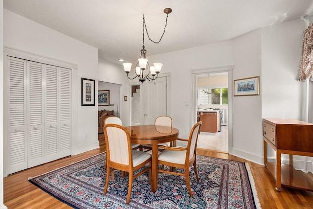 25 Autumn St, Everett, MA 02149 - dining space with a chandelier and light wood finished floors