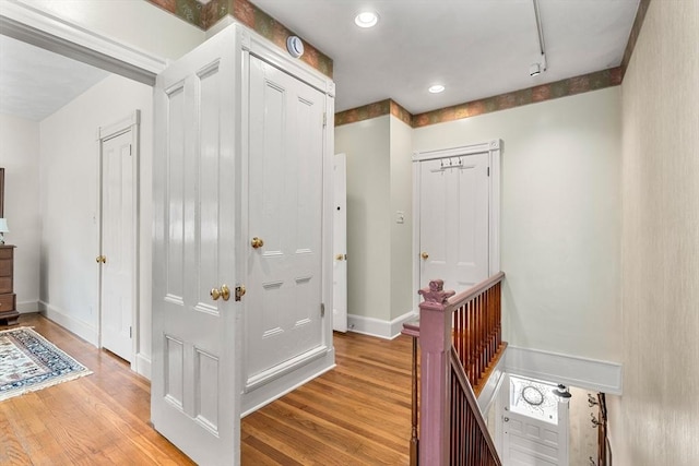25 Autumn St, Everett, MA 02149 - hallway with light wood-type flooring, an upstairs landing, recessed lighting, and rail lighting