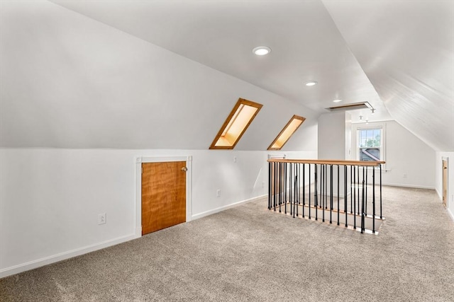 25 Autumn St, Everett, MA 02149 - additional living space with lofted ceiling, carpet, and recessed lighting