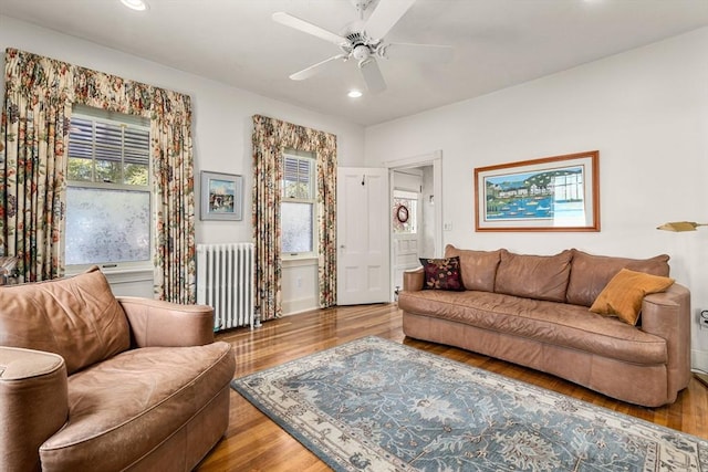 25 Autumn St, Everett, MA 02149 - living room with radiator, wood finished floors, recessed lighting, and ceiling fan