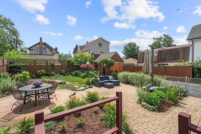 25 Autumn St, Everett, MA 02149 - fenced backyard with an outdoor living space, a patio, and outdoor dining area