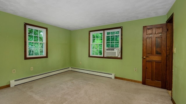 carpeted spare room with cooling unit and a baseboard radiator