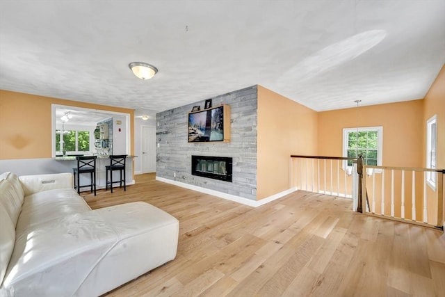 825 S St, Tewksbury, MA 01876 - living area featuring wood finished floors, a fireplace, and baseboards