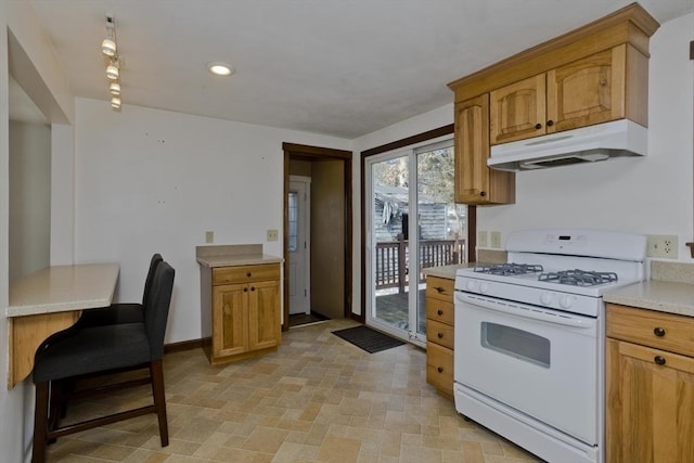 kitchen with white gas range oven