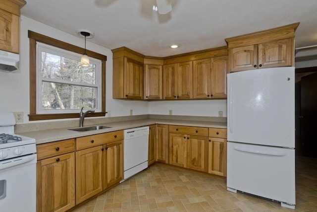 kitchen with pendant lighting, white appliances, ceiling fan, and sink