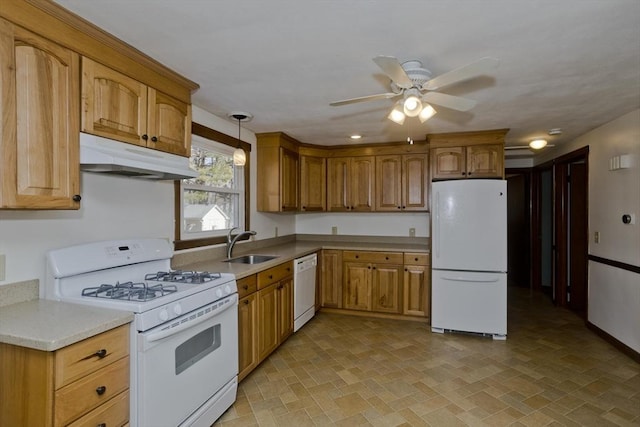 kitchen with sink, white appliances, decorative light fixtures, and ceiling fan