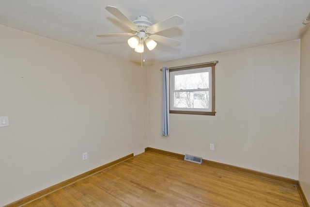 spare room featuring ceiling fan and light wood-type flooring