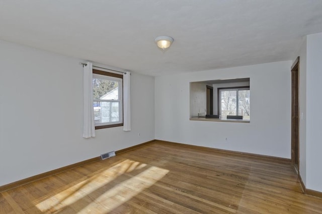 empty room with wood-type flooring