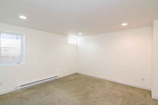 unfurnished room featuring recessed lighting, light carpet, and baseboard heating