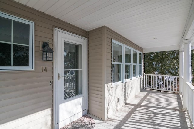 entrance to property featuring a porch