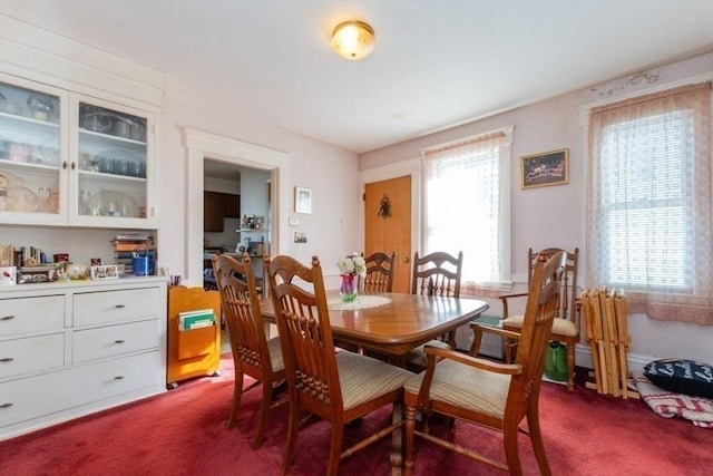 dining space with dark carpet