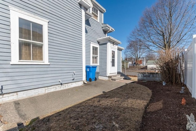 exterior space with entry steps and fence