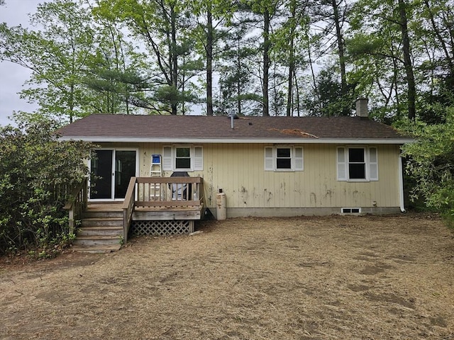 288 Leverett Rd, Shutesbury, MA 01072 - rear view of house with a chimney and a wooden deck