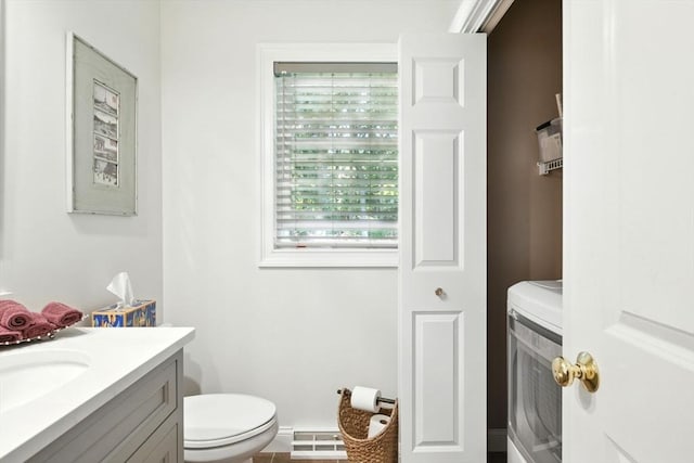 34 Hawks Cir, Westfield, MA 01085 - bathroom with vanity, a baseboard radiator, and washer / clothes dryer