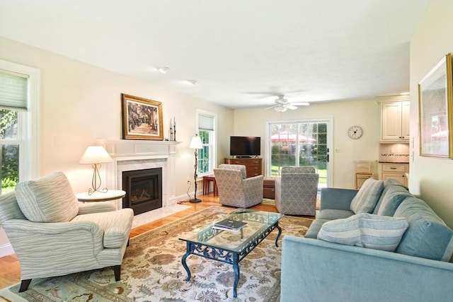 34 Hawks Cir, Westfield, MA 01085 - living area featuring ceiling fan, light wood finished floors, and a fireplace