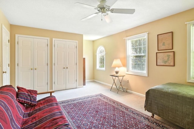 34 Hawks Cir, Westfield, MA 01085 - carpeted bedroom featuring multiple closets and ceiling fan