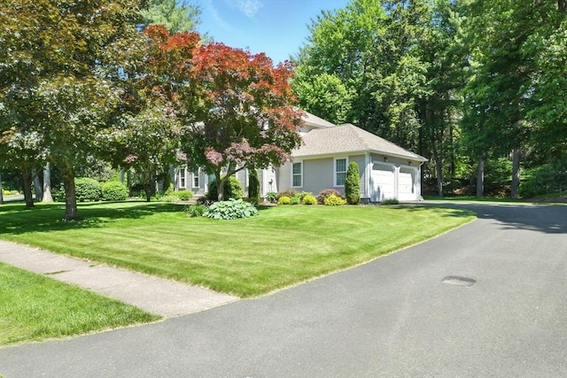 34 Hawks Cir, Westfield, MA 01085 - view of front of house with a garage, a front yard, and driveway