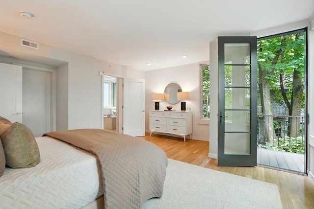 89 Kirkland St Unit 89, Cambridge, MA 02138 - bedroom featuring wood finished floors, recessed lighting, and connected bathroom