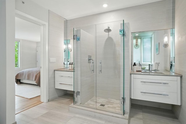 89 Kirkland St Unit 89, Cambridge, MA 02138 - bathroom with vanity, a stall shower, connected bathroom, and tile patterned flooring