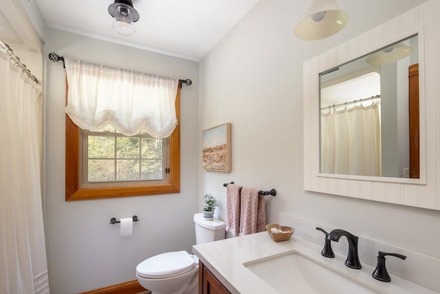 full bath featuring vanity and toilet