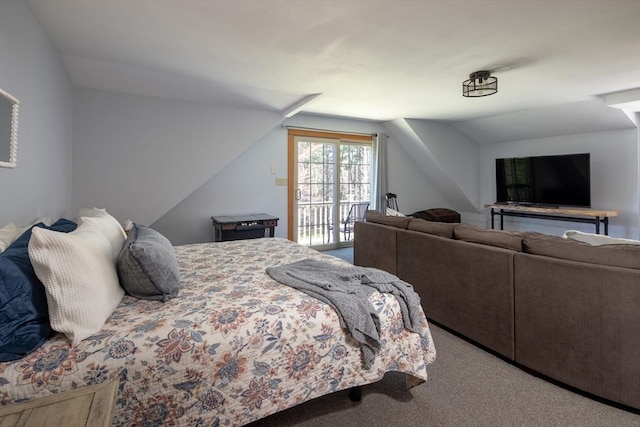 bedroom with access to outside, carpet, and vaulted ceiling