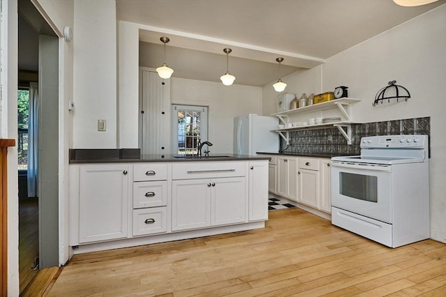 41 Coombs Hill Rd, Shelburne, MA 01340 - kitchen featuring white appliances, a sink, dark countertops, open shelves, and light wood-type flooring