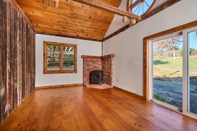 41 Coombs Hill Rd, Shelburne, MA 01340 - unfurnished living room featuring hardwood / wood-style flooring, a wood stove, high vaulted ceiling, beam ceiling, and wooden ceiling