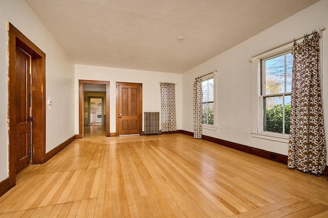 41 Coombs Hill Rd, Shelburne, MA 01340 - spare room featuring radiator heating unit, light wood-style flooring, and baseboards